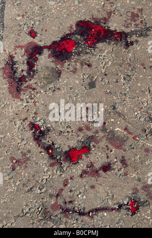 Blood from a stabbing incident in the road Hackney London 2008 Stock Photo