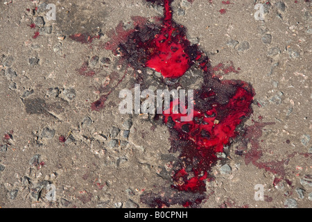 Blood from a stabbing incident in the road Hackney London 2008 Stock Photo