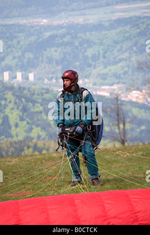 Paraglider waiting to jump from Kandel Mountain Black Forest Germany Stock Photo