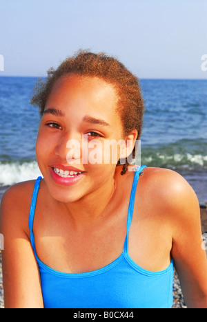 Portrait of a young beautiful girl on sea shore Stock Photo