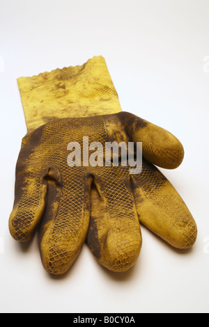 Dirty yellow rubber glove Stock Photo