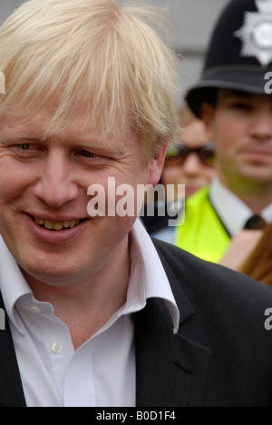 Mayor of London Boris Johnson with police constable in the background First day as mayor 5th April 2008 Stock Photo