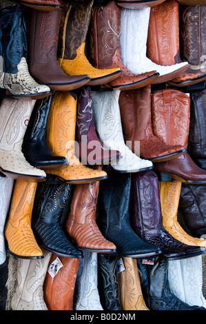 Cowboy boots hanging up for sale in market in Puebla, Mexico. Stock Photo