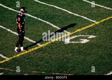 Football player standing at the goal line Stock Photo