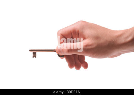 Person holding a door key Stock Photo