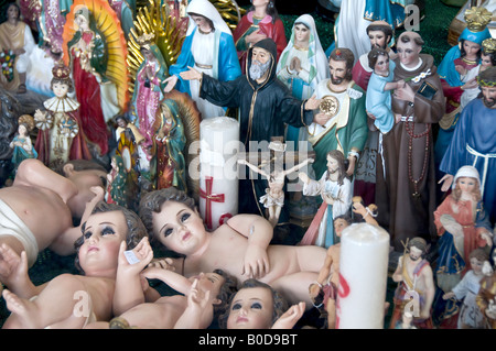 Huge collection of Catholic icons, including, Virgin Mary, baby Jesus and the Virgin of Guadalupe - much revered in Mexico. Photographed Mexico City. Stock Photo