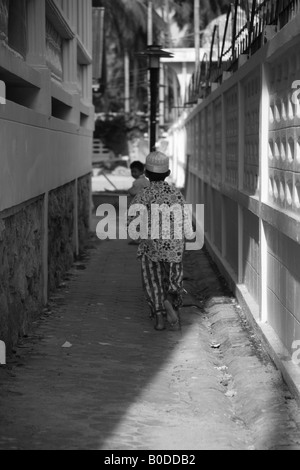 young muslim boy, running around , koh samui muslim community, thailand Stock Photo