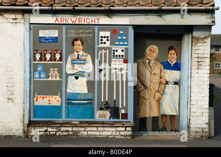 Village store shop closed down Chatteris Cambridgeshire. Wall art painting mural depicting the shop keepers UK HOMER SYKES Stock Photo