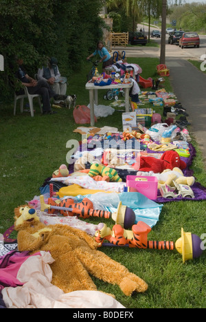 Consumer society, unwanted toys young girl has grown up, for sale at the side of the road. Stilton village Cambridgeshire UK 2000s HOMER SYKES Stock Photo