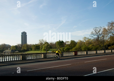 Biker on Serpentine Bridge in Hyde Park, spring London, W1, City of Westminster, Great Britain, UK Stock Photo