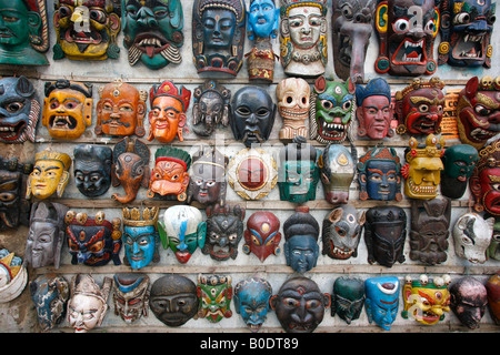 masks on wall in nepal Stock Photo