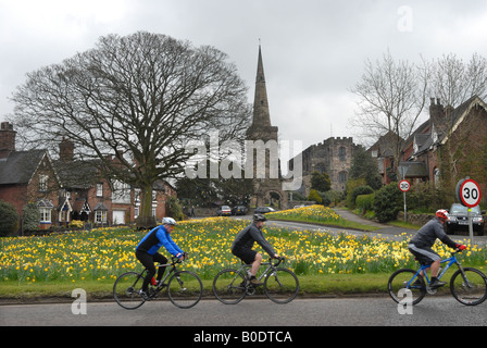 Photographer Howard Barlow Cycling in Cheshire through the village of ASTBURY Stock Photo