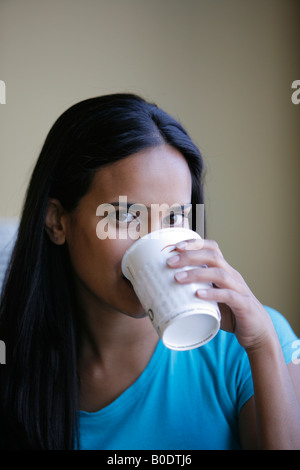 Young woman drinking coffee, indoors, Arlington, Virginia, USA, MR-4-18-08 Stock Photo