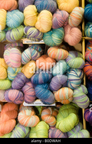skeins of alpaca and silk hand knitting wool coloured using only natural plant dyes colourings at Wonderwool Festival  wales UK Stock Photo