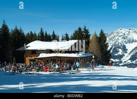 Mountaintop chalet/restaurant and bar above ski resort of Ellmau,with the Wilder Kaiser Mountains in the distance. Stock Photo