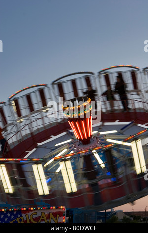 Spinning Round-Up Amusement Ride at Night Stock Photo - Alamy