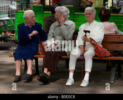 Three elderly women on a seat at Colmar Alsace France Stock Photo