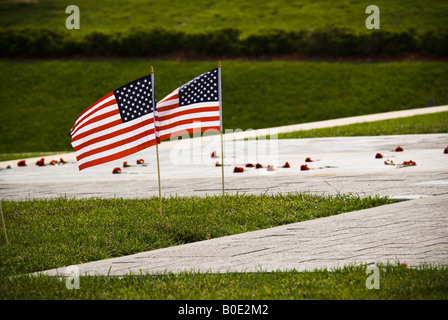 Two American flags in ground at memorial Stock Photo