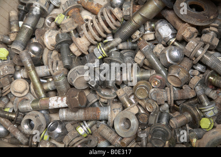 left over nuts, bolts and washers in an automotive workshop Stock Photo