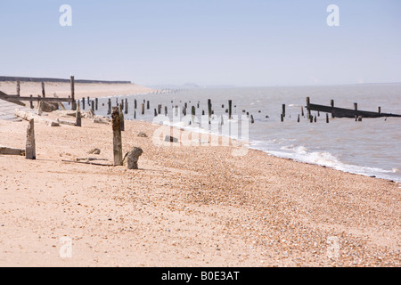 Breakwaters sand and blue sky at Tourist destination Seasalter beach in Kent England UK Stock Photo