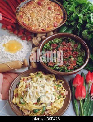 Country kitchen recipe, canadian bacon fettucini, prairie caesar salad, rhubarb custard crunch, dinner lunch dessert rolling pin Stock Photo