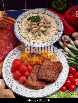 Heart made of tasty spaghetti, tomato, shrimps and cheese on light grey ...