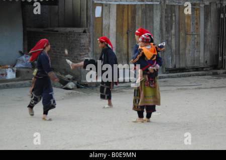 girls from the red dao hilltribe in traditional dress playing vietnamese style shuttlecock Stock Photo