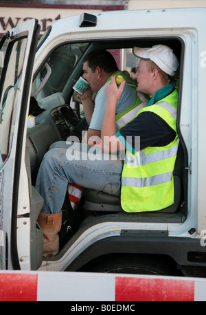 workmen on lunch break Stock Photo