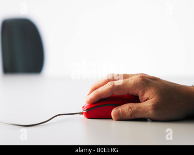 Arm moving the computer mouse Stock Photo