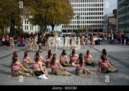 Maori dance troupe practice in Cathedral square Christchurch, before their formal theatre performance,New Zealand Stock Photo