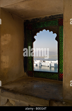 INDIA Udaipur View of the beautiful Lake Palace in Pichola Lake from one of the windows in the City Palace Stock Photo