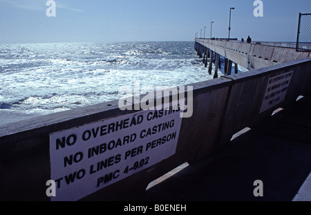 sign on pier at Sharp Park beach in Pacifica California Stock Photo