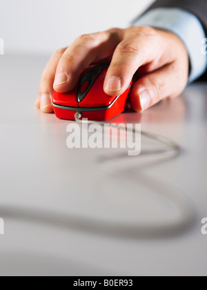 Front view of a hand moving a computer mouse Stock Photo