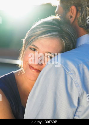 Mature man embracing mature woman Stock Photo