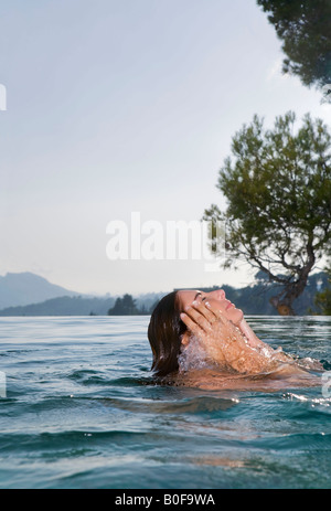 Young woman swimming in the pool Stock Photo - Alamy