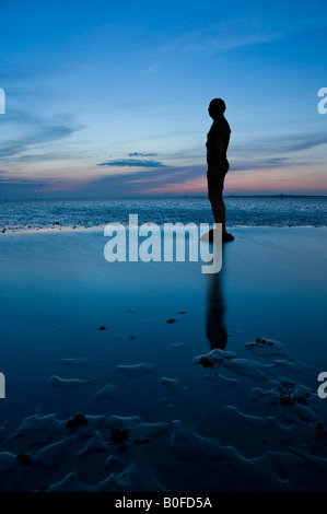 Antony Gormley's Another Place Statues at Twilight on Crosby Beach, Crosby, Merseyside, England, UK Stock Photo