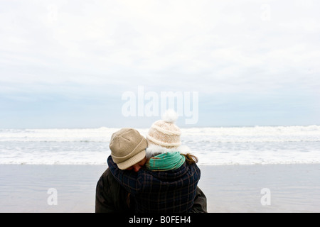 Couple hugging on beach Stock Photo