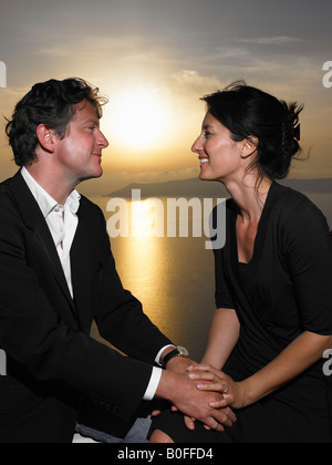 Couple looking at each other, sunset Stock Photo