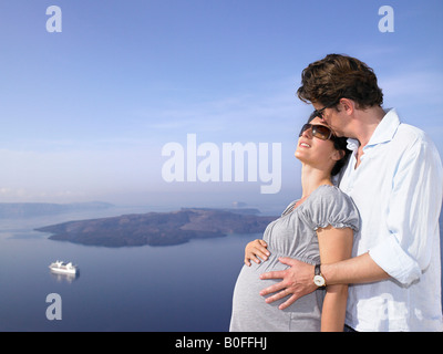 Pregnant woman and husband, sea view Stock Photo