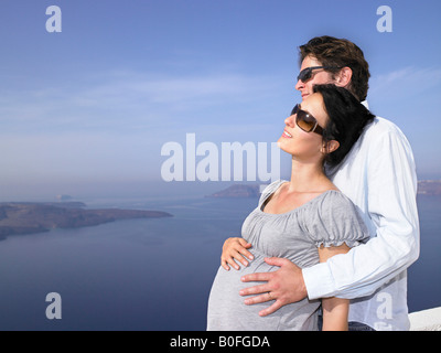 Pregnant woman and husband, sea view Stock Photo