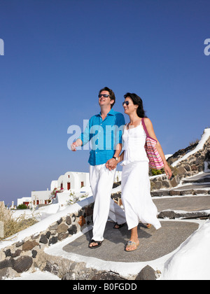 Couple climbing down the stairs Stock Photo