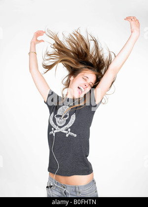 Woman dancing and listening to music Stock Photo