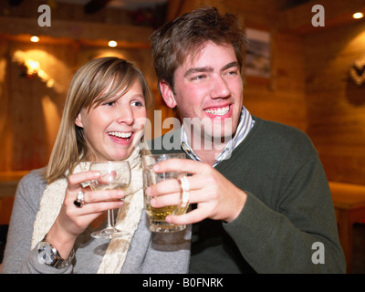 Couple having drinks in restaurant Stock Photo