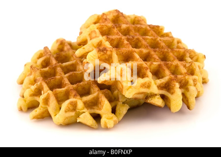 Two round and golden Belgian waffles on a clean white background. Stock Photo