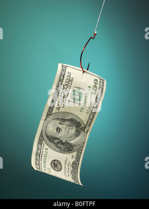 U.S. hundred dollar bill on hook as if a lure Stock Photo