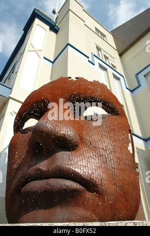 previous Marlowe theatre with giant face sculpture the Friars Canterbury Kent Stock Photo