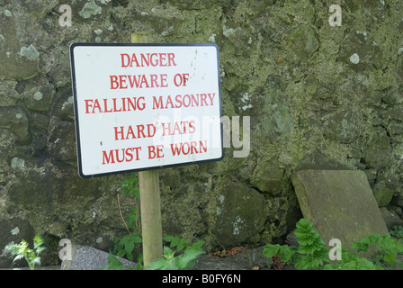 Sign 'Danger Beware of Falling Masonry. Hard Hats Must be Worn' Stock Photo