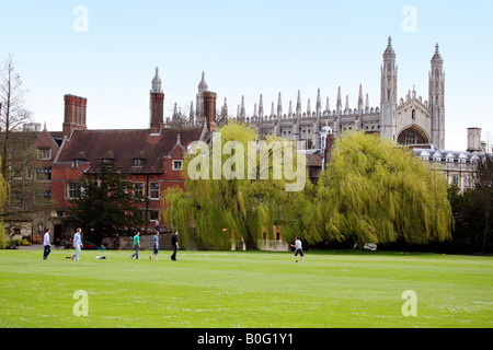 University students playing Frisbee on the lawns near Kings College, Cambridge, UK Stock Photo