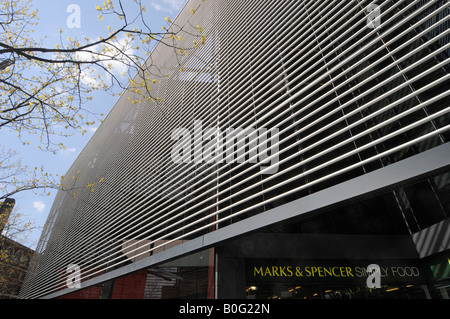 London Marks and Spencer Simply food store sign below modern office redevelopment Stock Photo