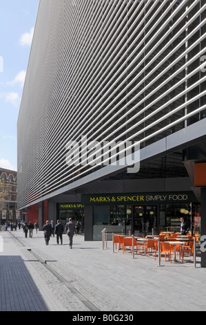 Marks and Spencer Simply food retail business store and pavement bar below modern More London office redevelopment Southwark London England UK Stock Photo